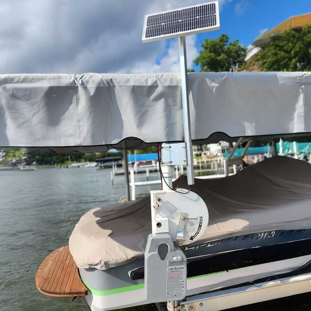Boat lift motor with solar charger