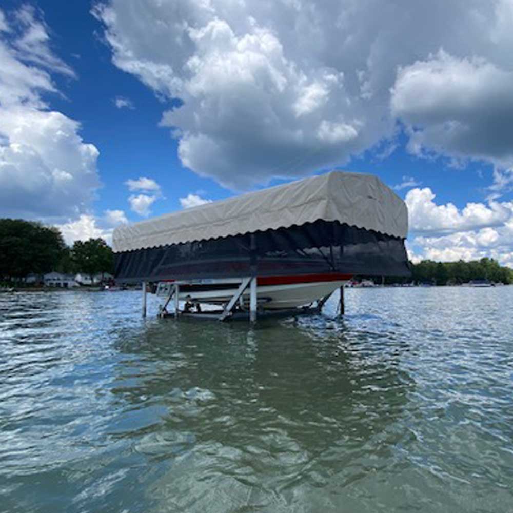 Marine curtain and canopy shown with a boat in the lift