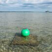 Aqua Lantern solar buoy green shown in the day