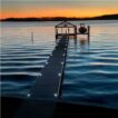solar deck light on dock in water