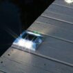 solar deck light on wooden decking