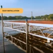 side view of truss frame dock with brown aluminum decking