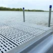 low profile floating dock with gray poly decking and side float