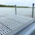 low profile floating dock with gray poly decking and side float
